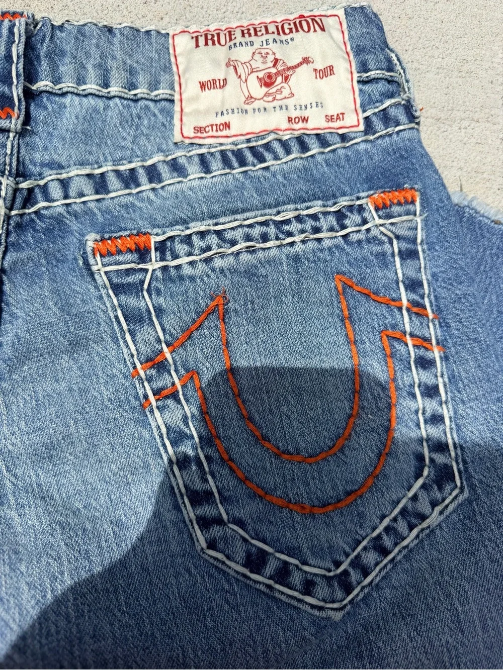 Denim Cutoff Bermuda Shorts in Medium Blue